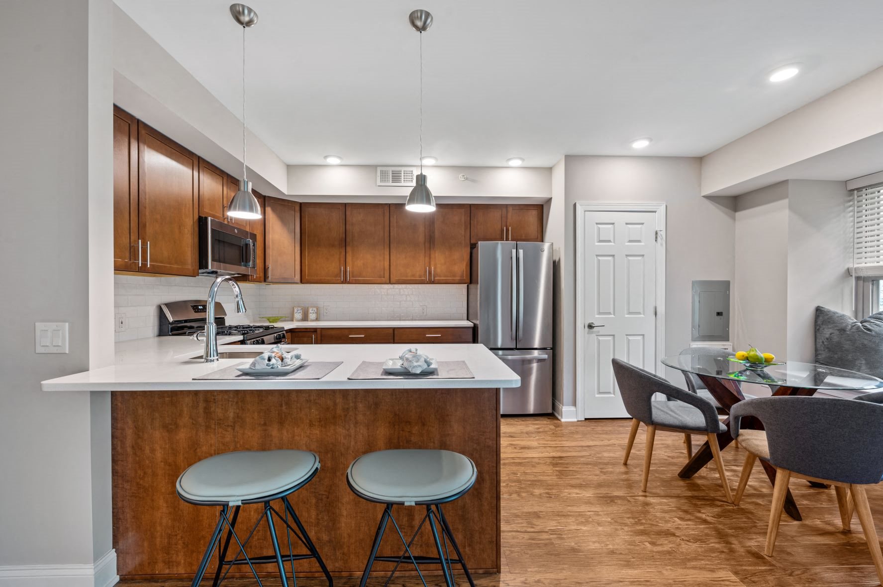 Kitchen at Severgn with hardwood flooring, dining area, and breakfast bar